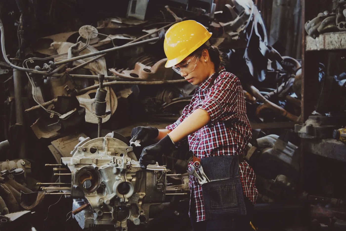 Manufacturing workers receiving safety training near industrial machinery