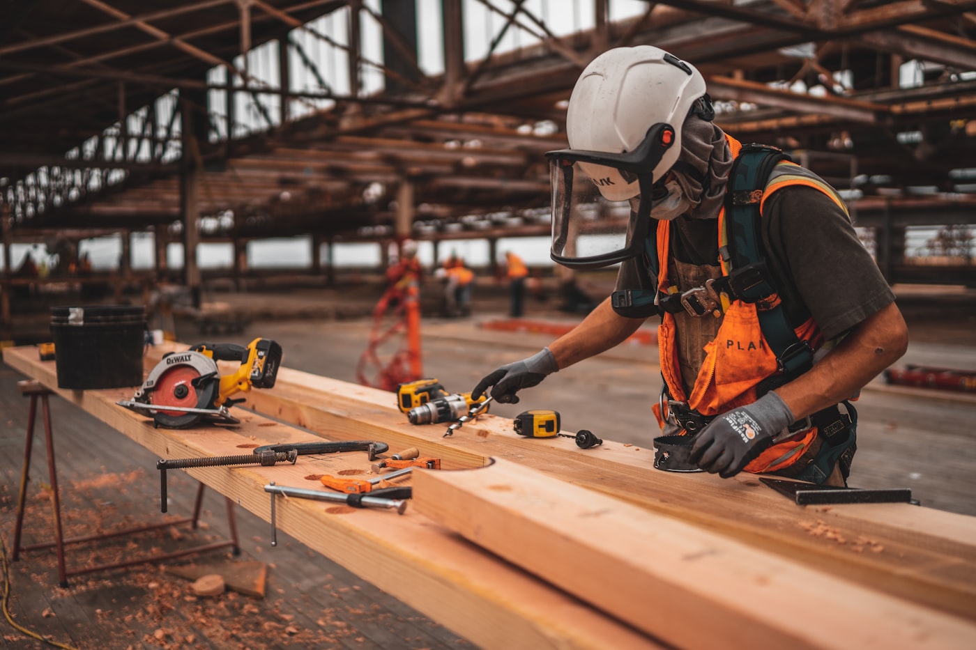 Construction workers wearing high-visibility PPE on site